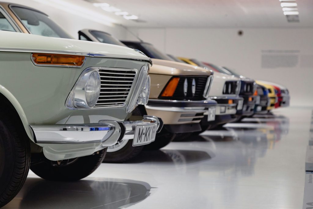 Classic cars lined up in showroom display